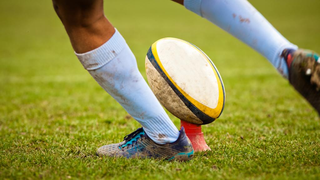 bigstock-rugby-player-preparing-to-kick-237862285